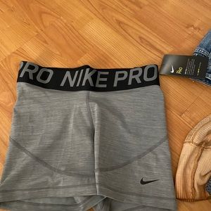 Gray and black Nike Pro shorts